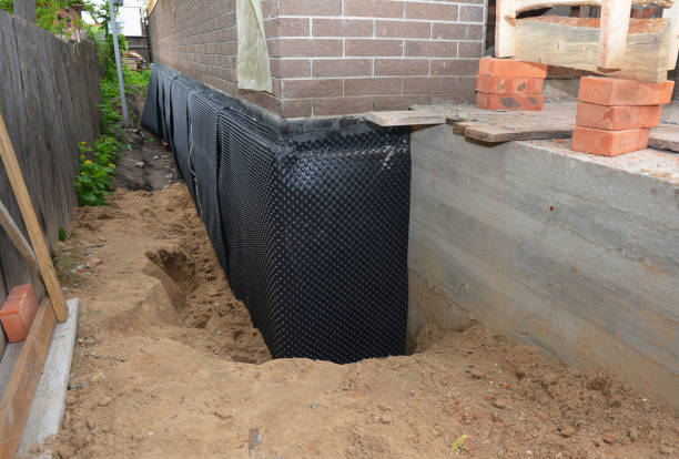 SJ Waterproofing Pros technician performing targeted Sump Pump Installation assessment in Delta, OH